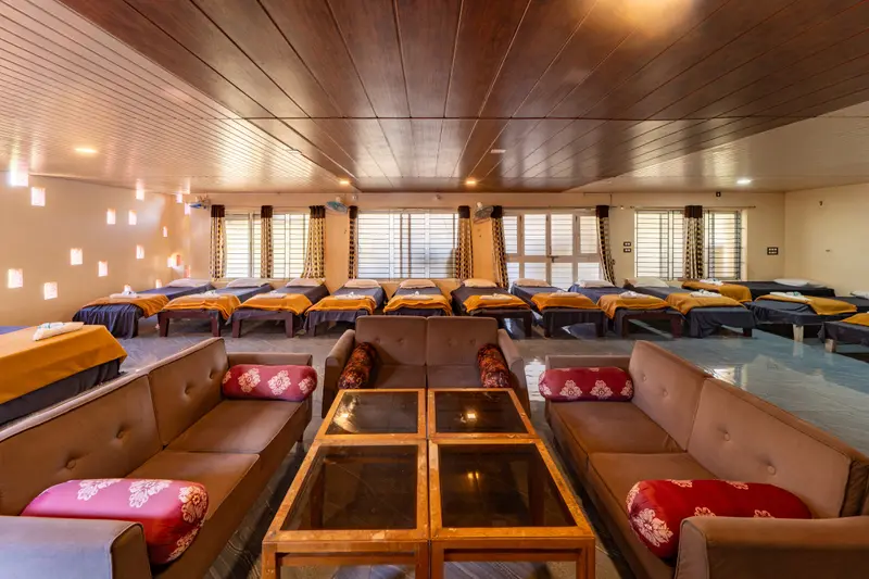 Dormitory hall with beds and sofas