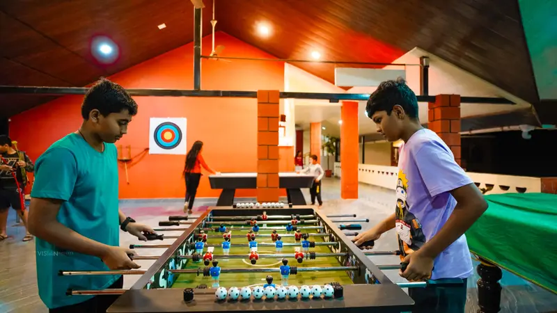 Two guests playing table football