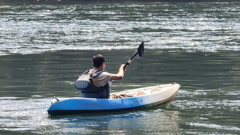 A guest kayaking on the Kali River
