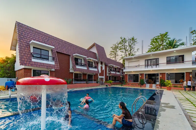 Guests playing under the pool fountain