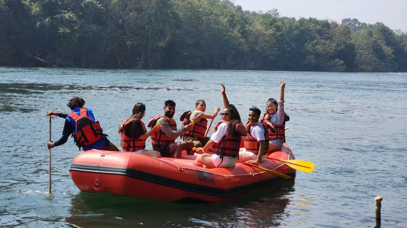 A group in an inflatable boat on the river