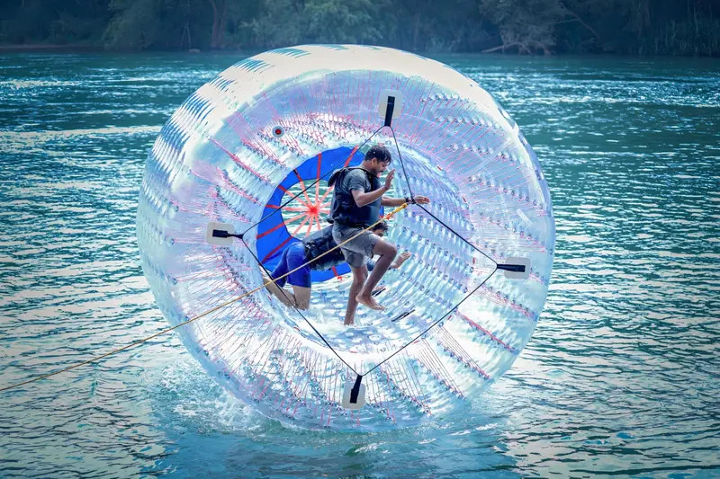 A guest inside a water zorb ball